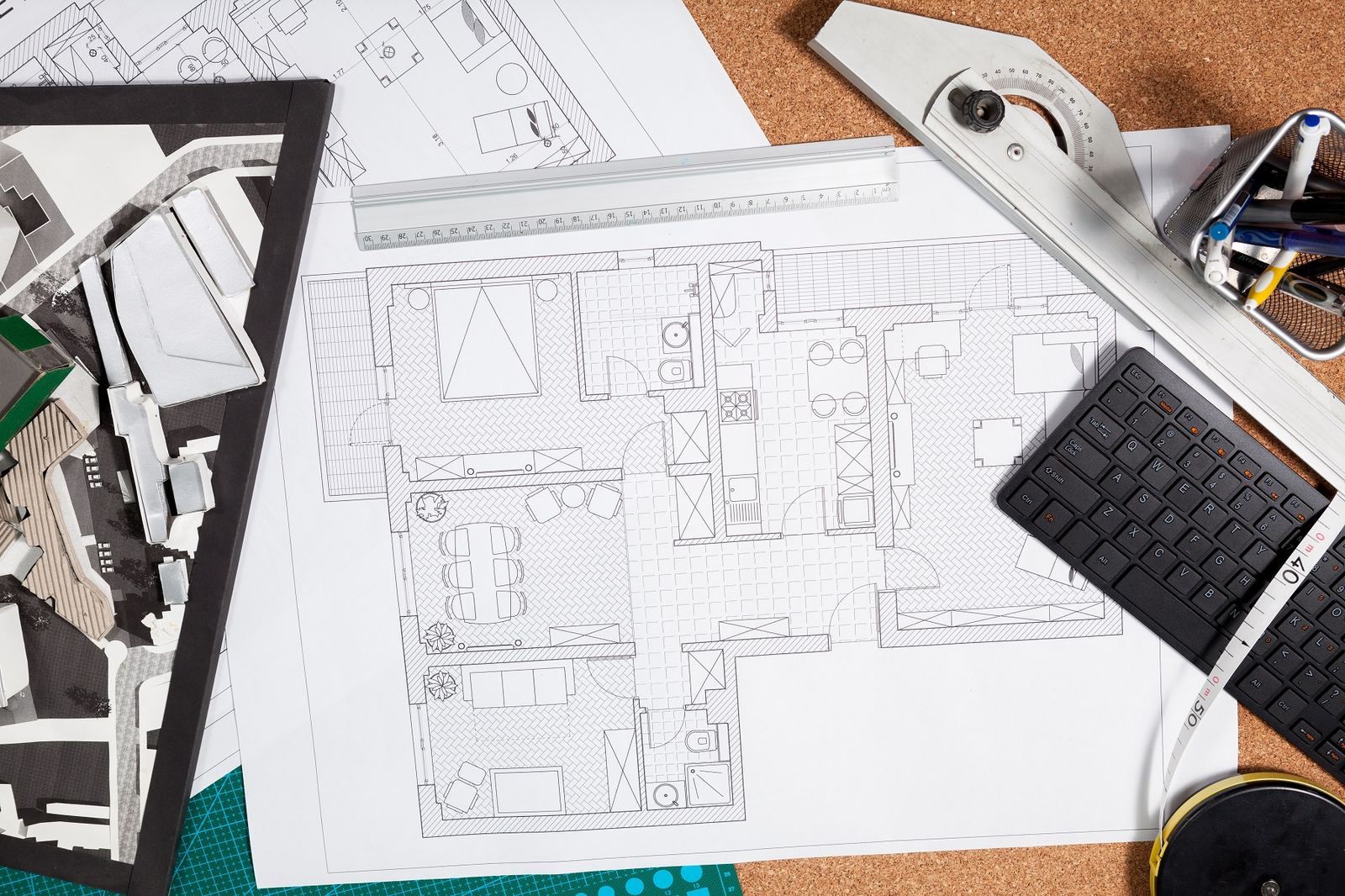 Architectural blueprints and house plans on a table